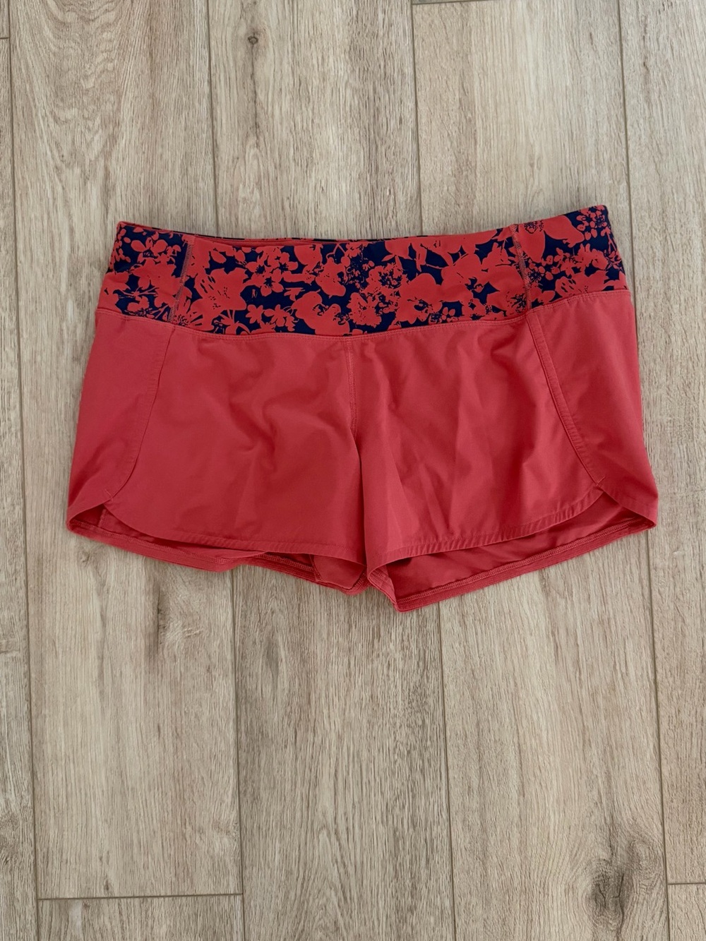 lululemon athletica Coral Running Shorts with Navy Floral Waistband